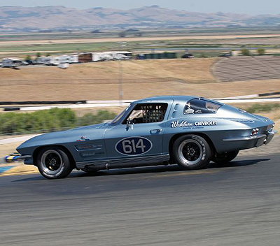 Bob Earle hustles his '63 Split-Window Vette through the top of the circuit. Corvette in its 60th year was the Festival's featured marque. [Sports Car Digest image by Dennis Gray]