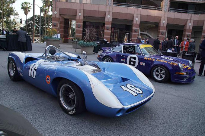Lola T70 (No. 16) and Porsche No,.6) on display in the courtyard. [Albert Wong image]