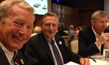 Hurley Haywood with Porsche's Alwin Springer and Owen Hayes. [Judy Stropus image]