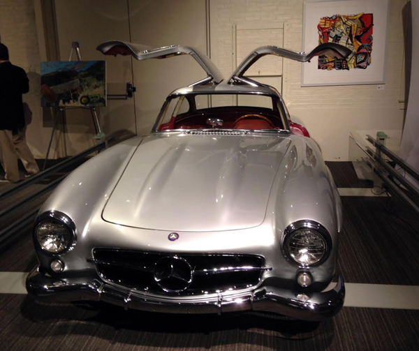 Posey's Mercedes-Benz 300SL surrounded by Sam's art. [Judy Stropus image]